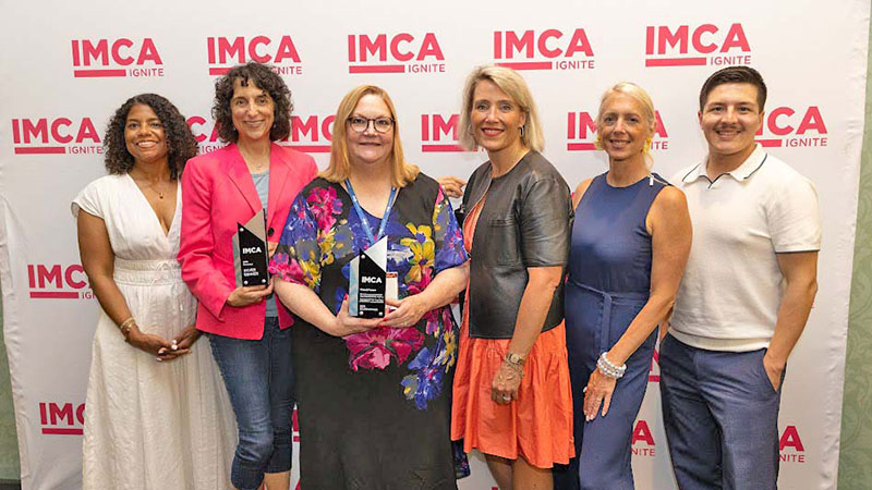 Group of people holding award
